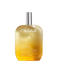 Caudalie Soleil Des Vignes Uljni eliksir 100 ml - hranjivo ulje za tijelo. Obogaćen uljima argana, shea, sjemenki grožđa i badema, poboljšava elastičnost kože i trenutačno je posvjetljuje. Žuto srebrna bočica na bijeloj pozadini.