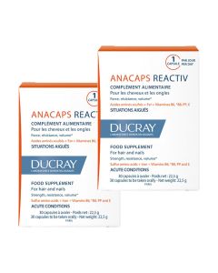 Ducray Anacaps Reactiv 2 x 30 kapsula Duo pakiranje - sadrže osnovne hranjive tvari za održavanje zdrave kose. Okus čokolade. Dvije bijelo plavo narančaste kutije na bijeloj pozadini.