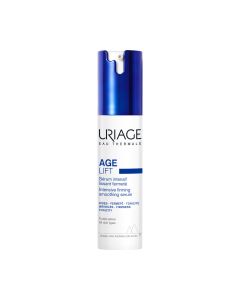 Uriage AGE LIFT intenzivan učvršćujući zaglađujući serum 30 ml - intenzivno zaglađujući i učvršćujući serum djeluje istovremeno na bore, čvrstoću i na svakodnevne agresije kojima je koža izložena. Tamno plavo bijela bočica s pumpicom na bijeloj pozadini.