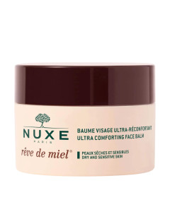 NUXE Rêve de Miel Iznimno umirujući balzam za lice 50 ml - intenzivno njeguje, umiruje i obnavlja kožu, istovremeno ju štiteći od vanjskih čimbenika. Smeđe bež zelena posudica proizvoda na bijeloj pozadini.