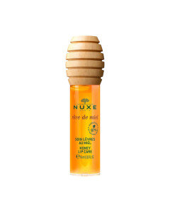 NUXE Rêve de Miel Medena njega za usne s aplikatorom 10 ml - prepustite se njegovoj 2 u 1 formuli koja njeguje i hidratizira usne, a pri tome nema ljepljivu teksturu. Žuto zeleni stik na bijeloj pozadini.