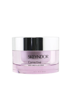 Skeyndor Corrective Krema protiv dubokih bora 30 ml - krema za korekciju dubokih bora i mimičkih bora koja popunjava i smanjuje bore kombinacijom dvije tehnike popunjavanja. Rozo srebrna posudica na bijeloj pozadini.